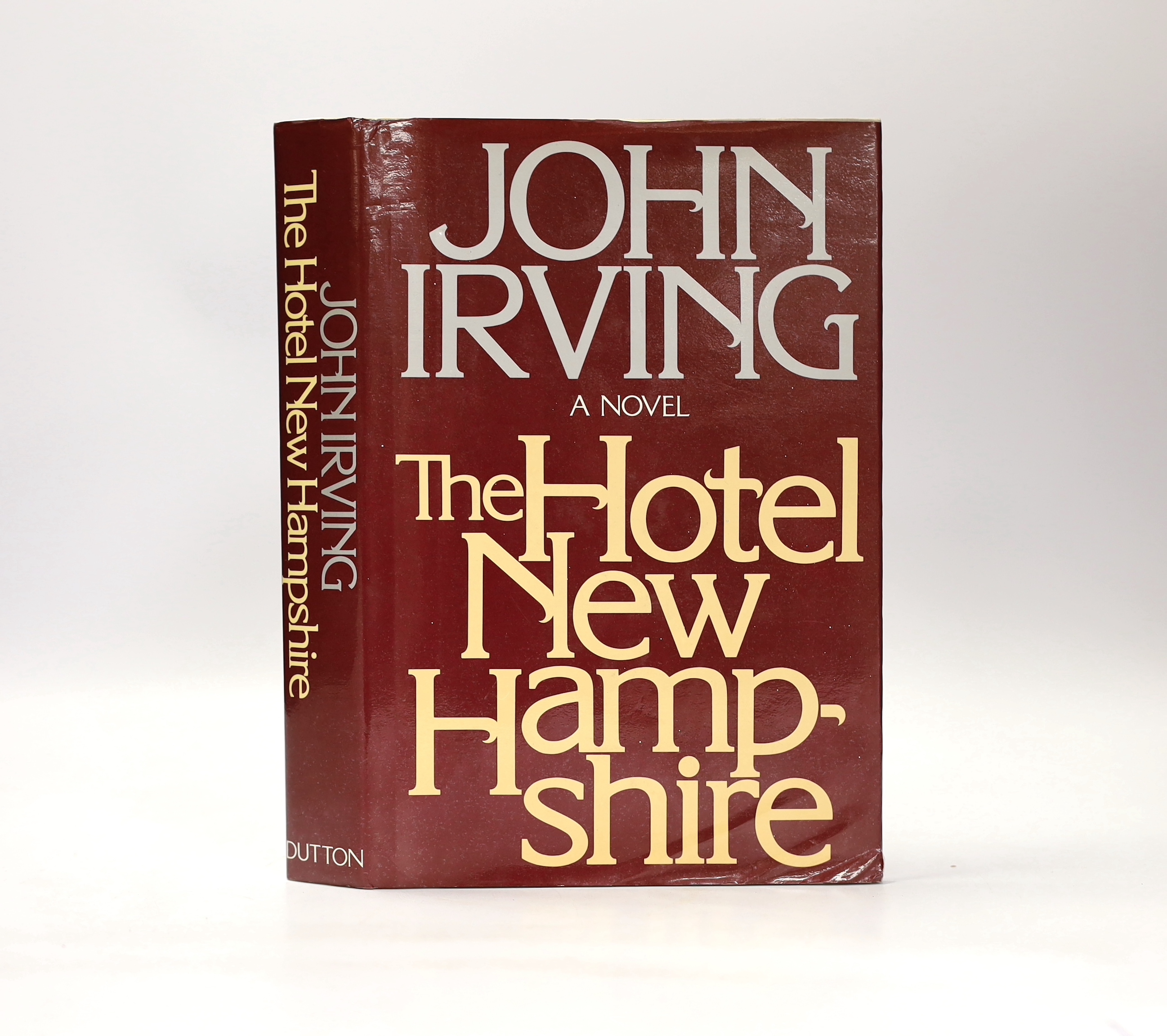 Irving, John - The Hotel New Hampshire, 1st edition ,8vo, half cloth in clipped d/j, presentation inscription by Robert Lowe, star of the film of the present book, to David Watkin, the film’s cinematographer, to front fl